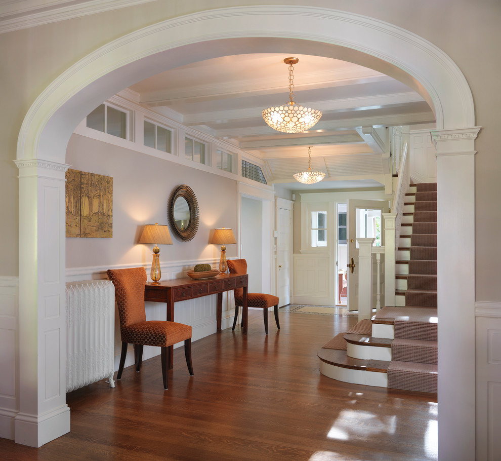 Inspiration for a traditional foyer in Boston with dark hardwood floors and a single front door.