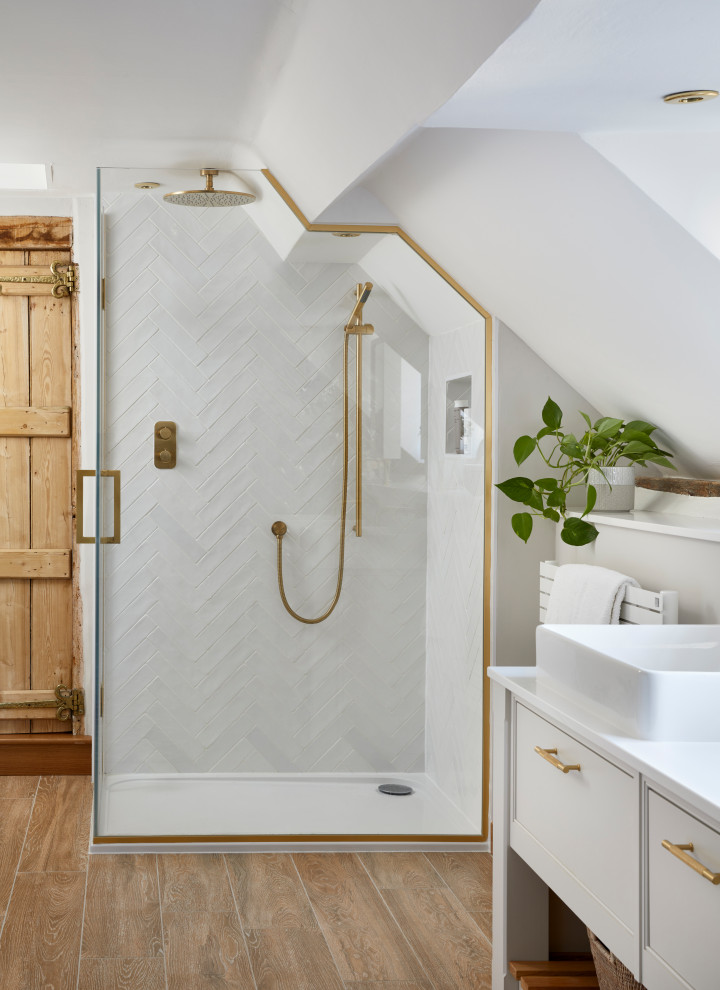 Photo of a mid-sized contemporary master bathroom in Buckinghamshire with white cabinets, a drop-in tub, a curbless shower, a wall-mount toilet, white tile, porcelain tile, white walls, porcelain floors, a drop-in sink, quartzite benchtops, beige floor, a hinged shower door, white benchtops, a double vanity and a built-in vanity.