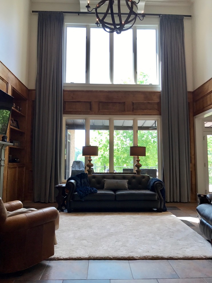 This is an example of a traditional living room in Birmingham with ceramic floors.