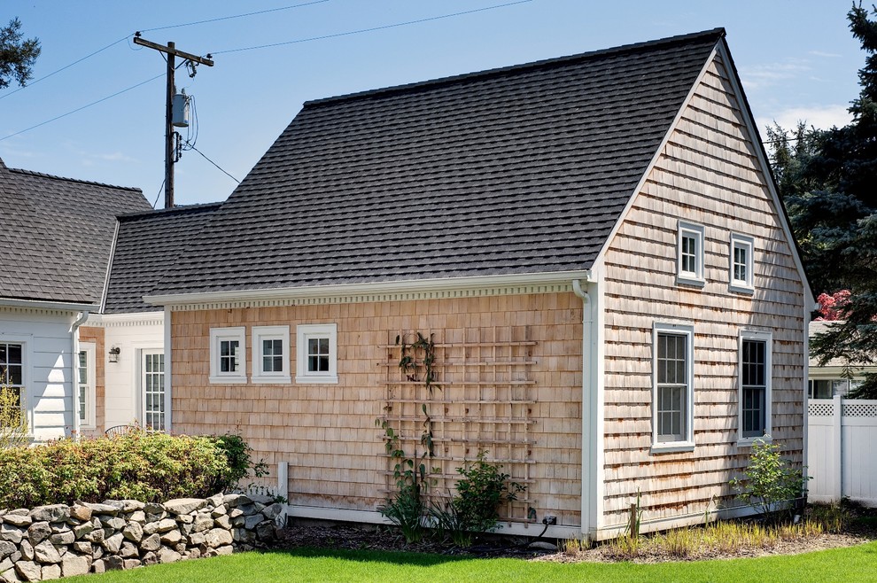 Mid-sized traditional two-storey white exterior in Portland with wood siding.