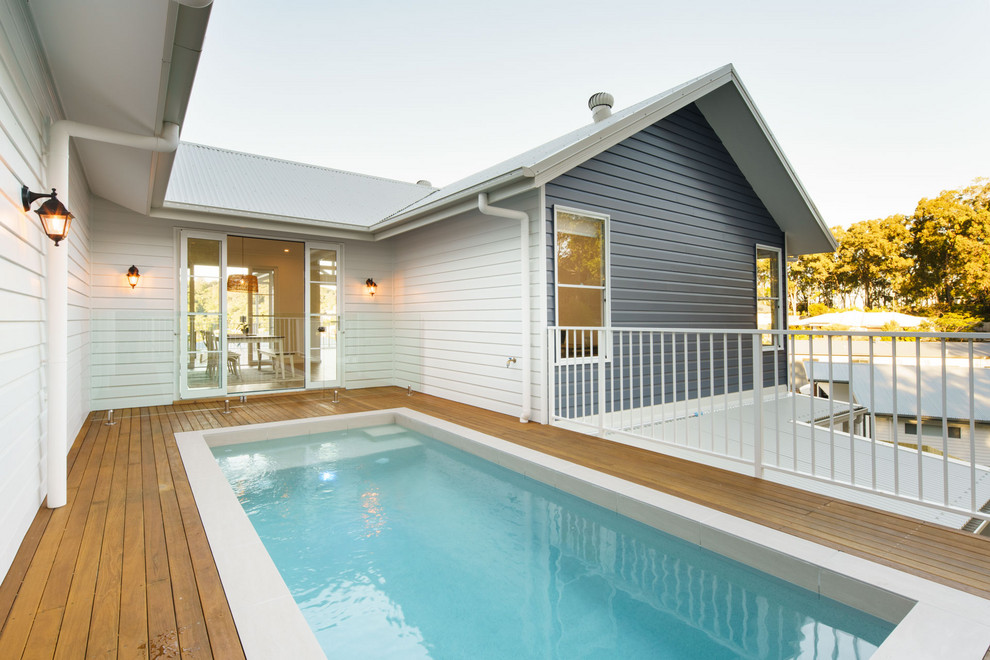 Inspiration for a mid-sized traditional rooftop rectangular aboveground pool in Sunshine Coast.