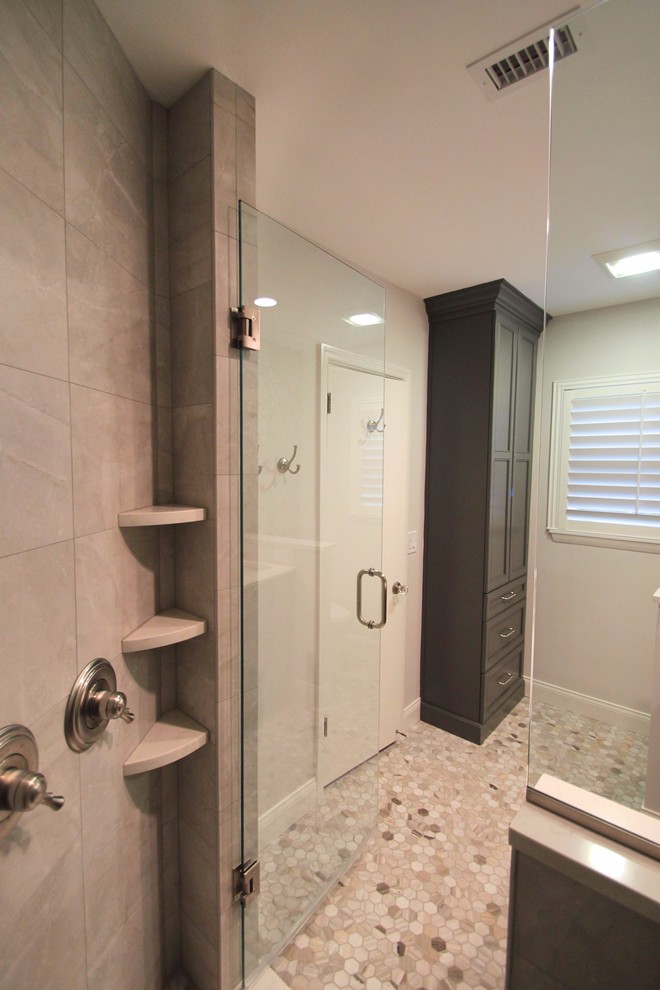 Design ideas for a mid-sized transitional master bathroom in Orlando with recessed-panel cabinets, dark wood cabinets, a corner shower, porcelain tile, grey walls, quartzite benchtops, grey floor, a hinged shower door, gray tile and marble floors.