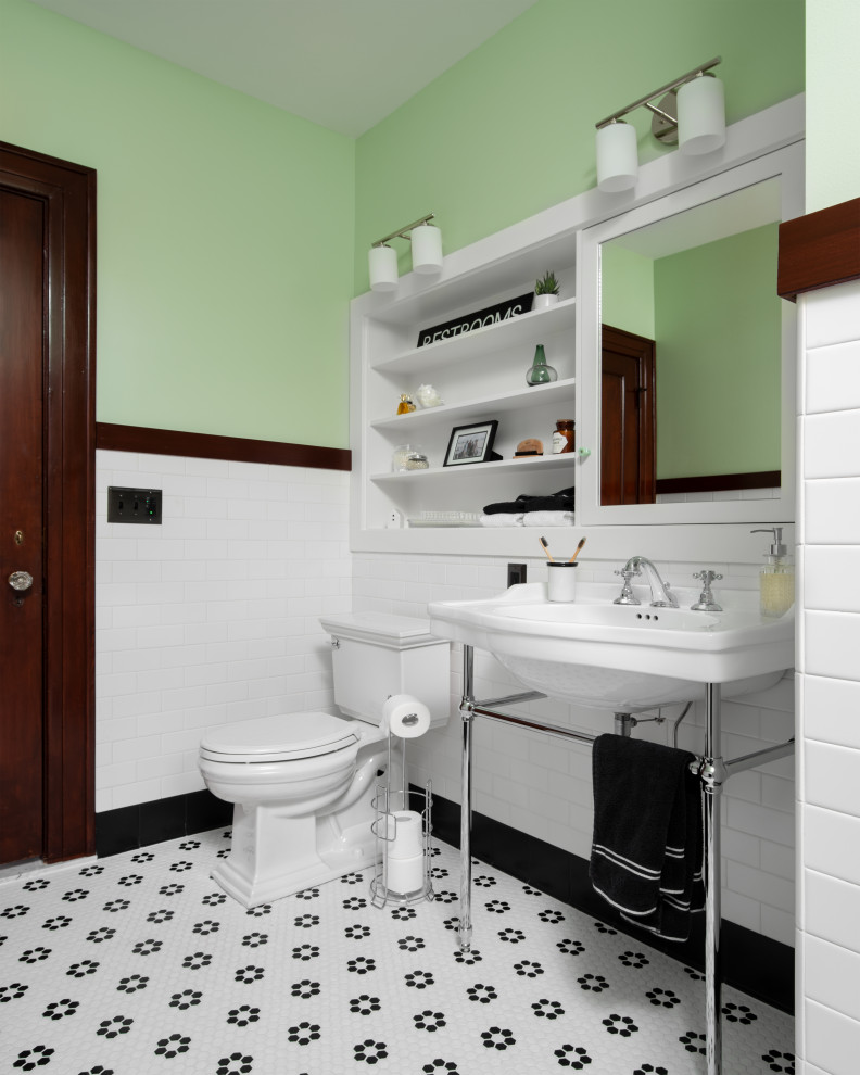 Inspiration for a mid-sized timeless 3/4 ceramic tile mosaic tile floor, multicolored floor and single-sink alcove shower remodel in Kansas City with a two-piece toilet, green walls, a console sink and a hinged shower door