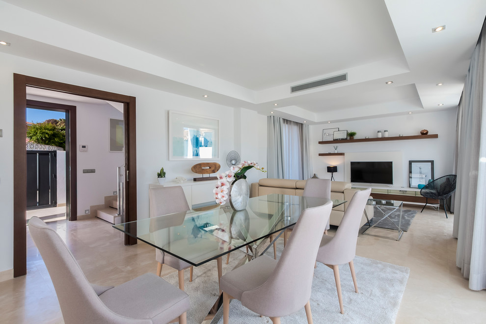 Foto de comedor moderno grande con paredes blancas, suelo de mármol y suelo beige