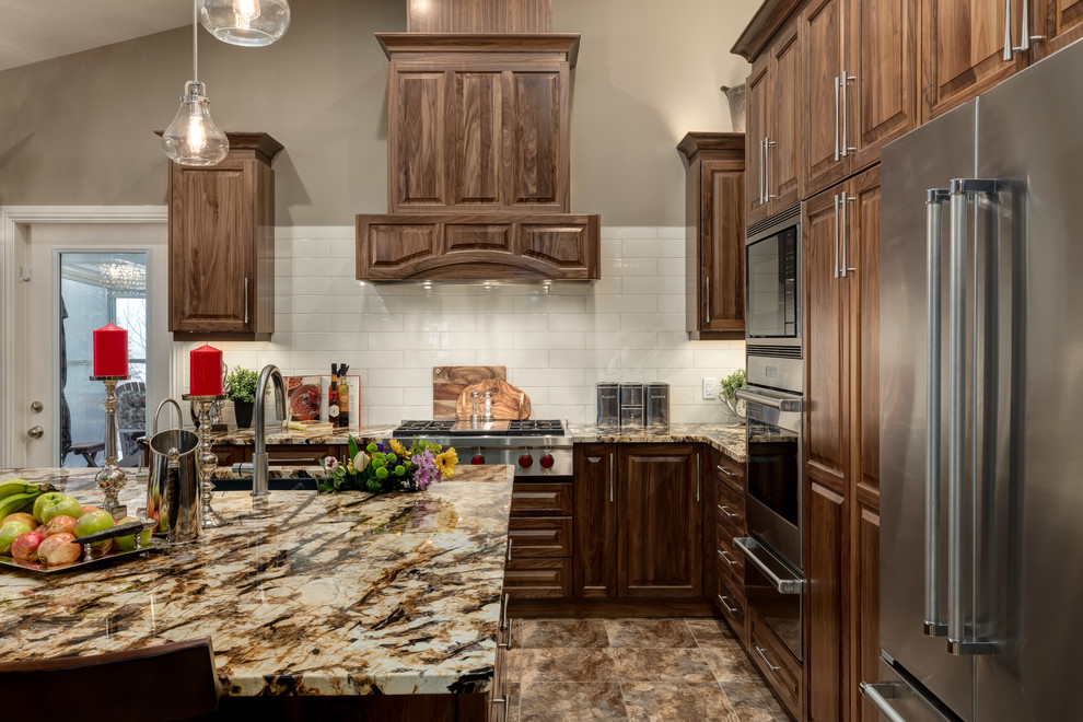 Example of a transitional kitchen design in Calgary
