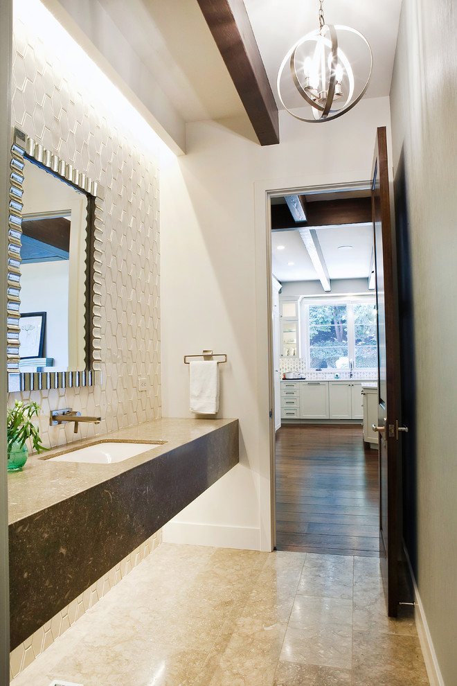 Inspiration for a mid-sized modern bathroom in Boise with open cabinets, brown tile, stone tile, white walls, travertine floors, an undermount sink and marble benchtops.
