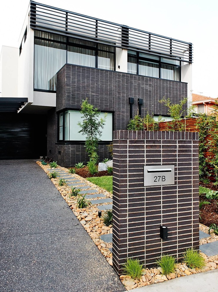 Inspiration for a contemporary two-storey grey exterior in Melbourne.