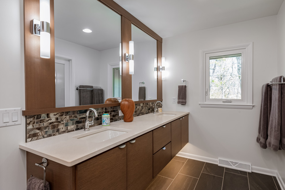 Inspiration for a large midcentury master bathroom in Milwaukee with flat-panel cabinets, brown cabinets, white tile, mosaic tile, white walls, porcelain floors, an undermount sink, engineered quartz benchtops, grey floor, white benchtops, a double vanity and a floating vanity.