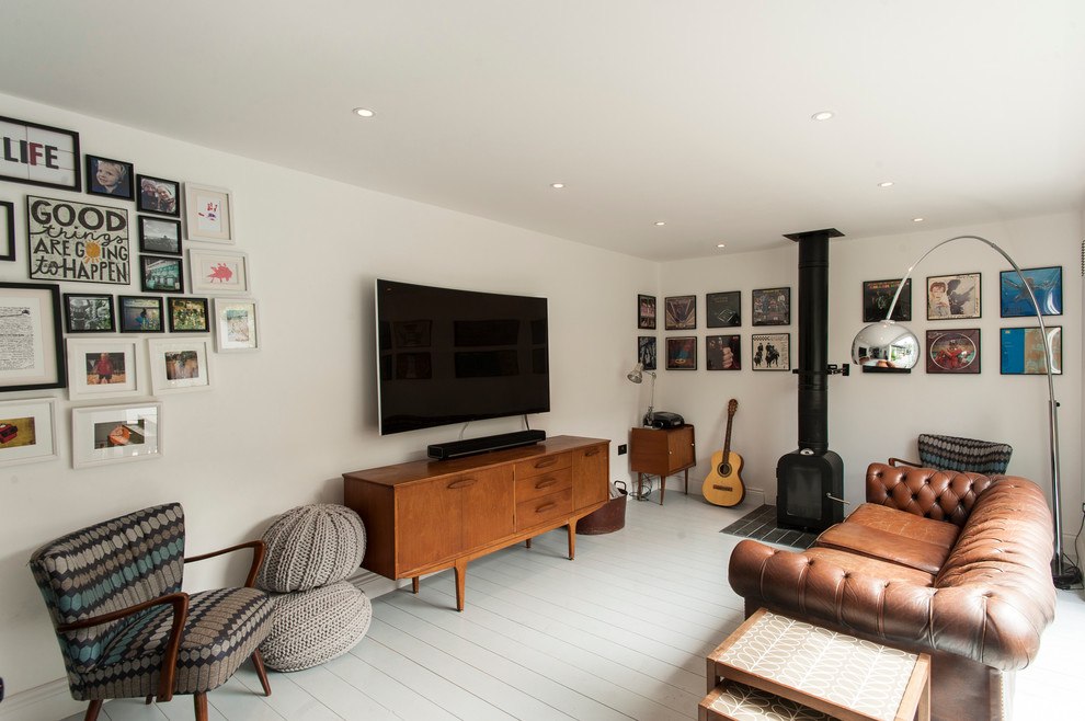 This is an example of a transitional family room in London.