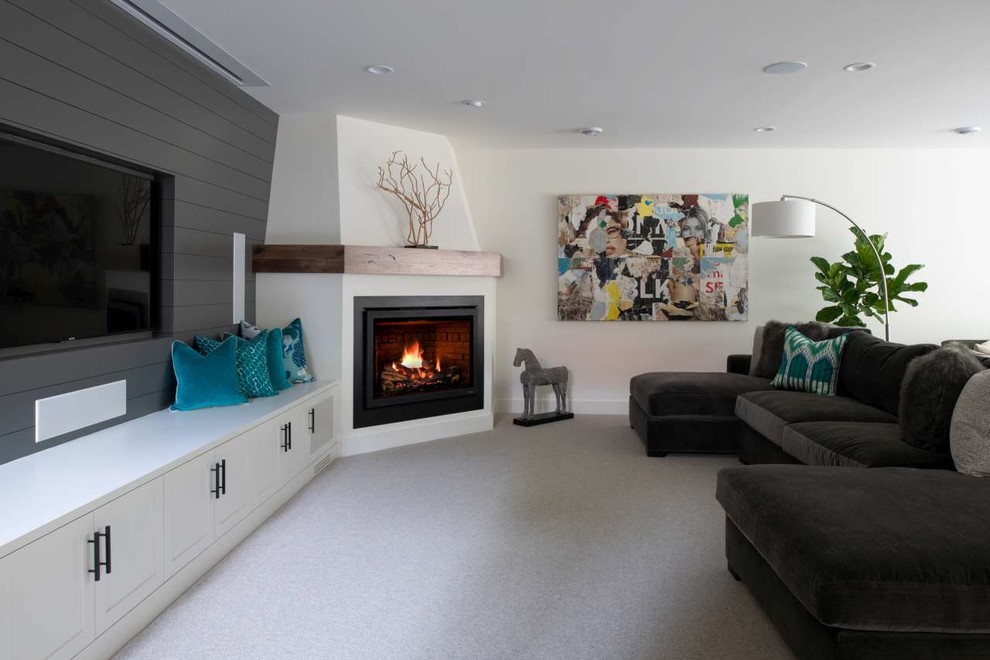 Inspiration for a contemporary family room in Minneapolis with white walls, carpet, a corner fireplace, a plaster fireplace surround and grey floor.