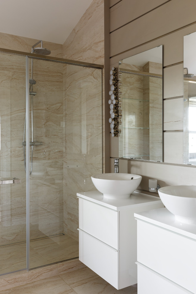 Inspiration for a large ensuite bathroom in Saint Petersburg with flat-panel cabinets, white cabinets, a submerged bath, a double shower, a wall mounted toilet, beige tiles, porcelain tiles, beige walls, porcelain flooring, a vessel sink, solid surface worktops, beige floors, a hinged door and white worktops.