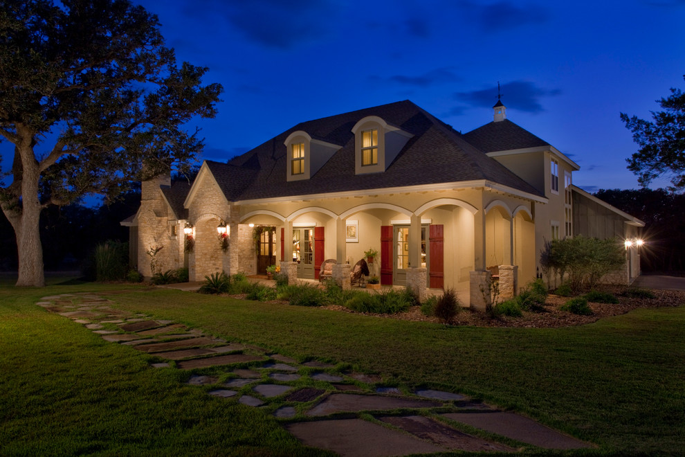 This is an example of a mid-sized two-storey stucco exterior in Austin.