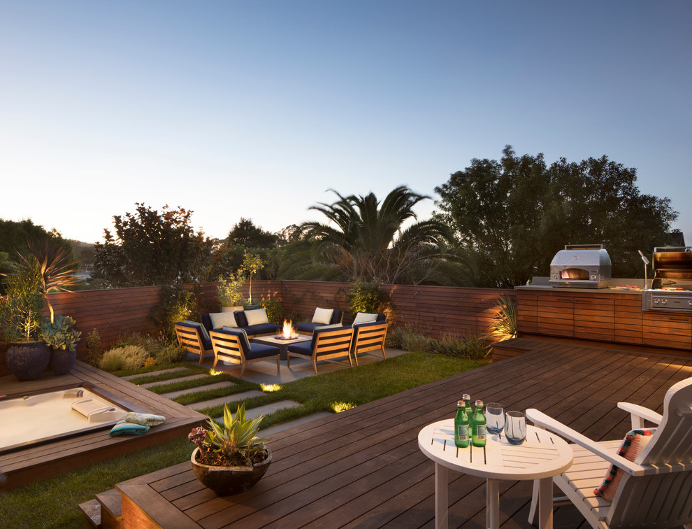 Mid-sized contemporary backyard deck in San Francisco with no cover and a fire feature.