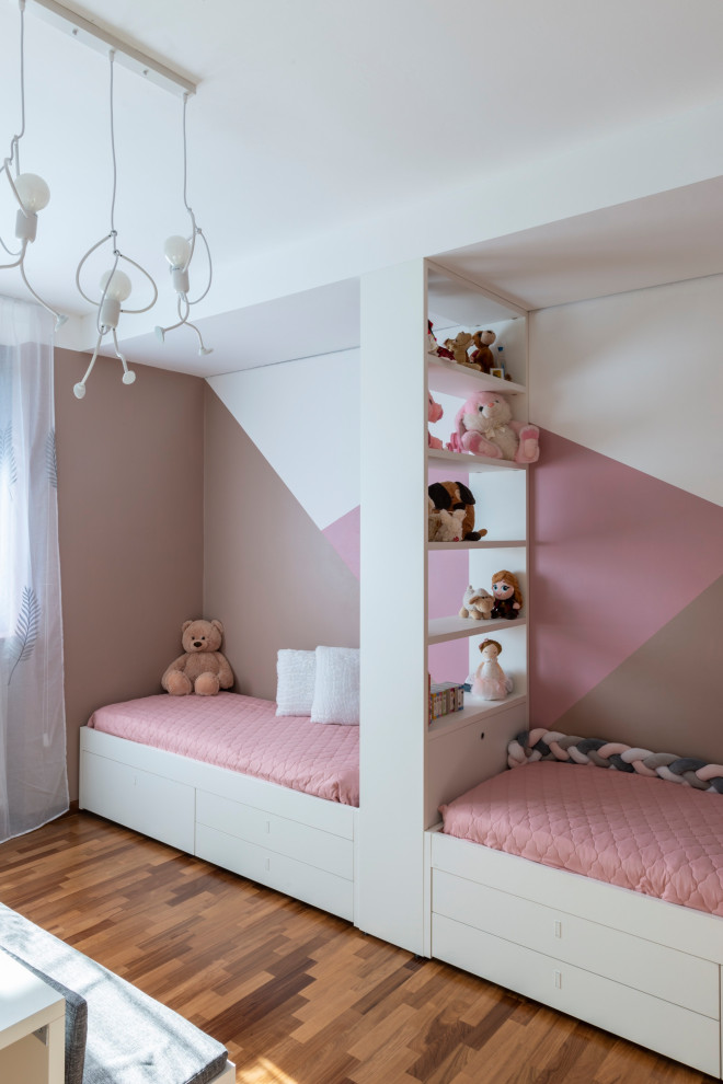 Photo of a large contemporary bedroom in Milan with pink walls, dark hardwood floors, no fireplace and brown floor.