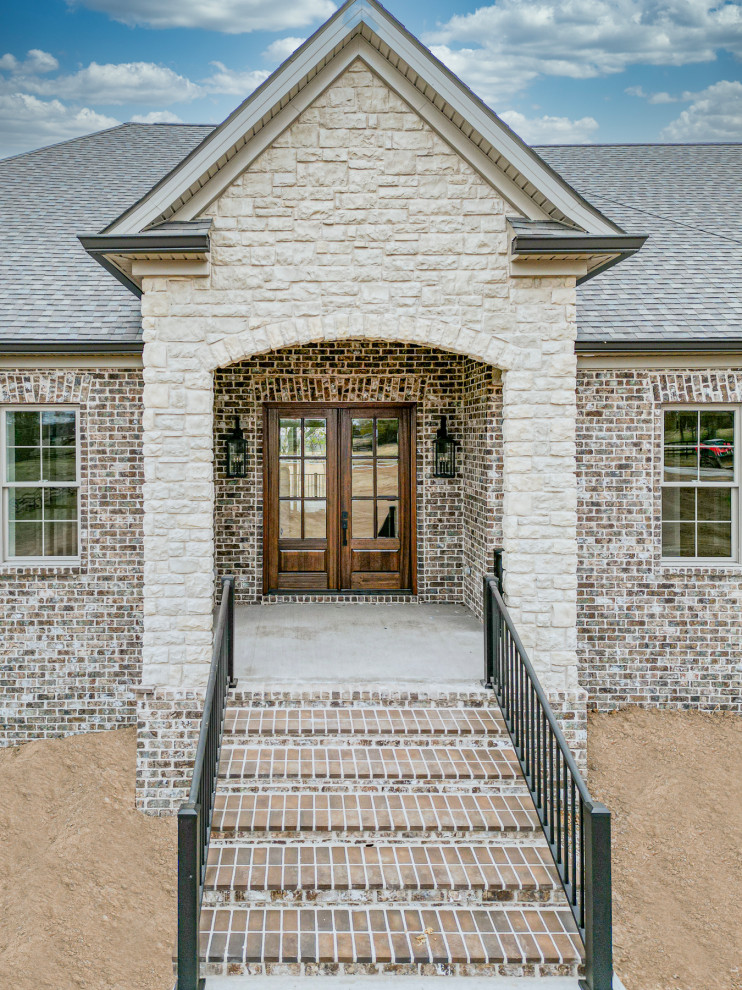Inspiration for a huge transitional front door remodel with a dark wood front door