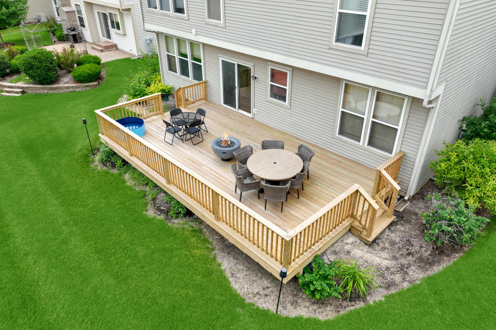 Backyard wood railing deck photo in Chicago