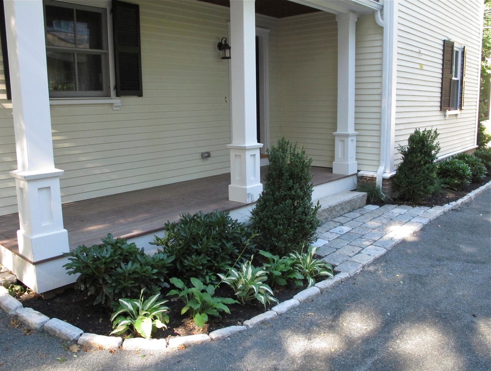 This is an example of a small traditional side yard verandah in Boston with decking.