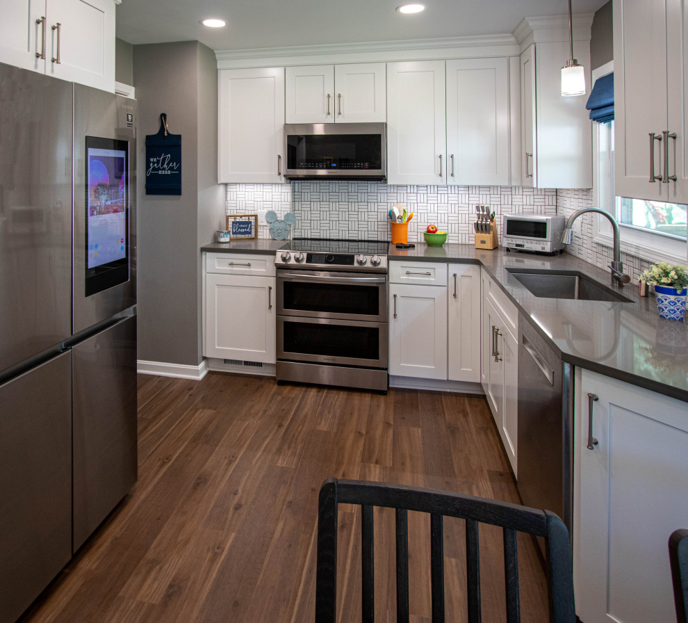 White Kitchen with White Tile Backsplash and Quartz Countertop ...