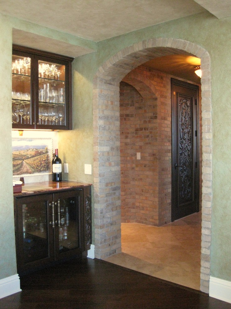 Photo of a large mediterranean open plan dining in Tampa with green walls.