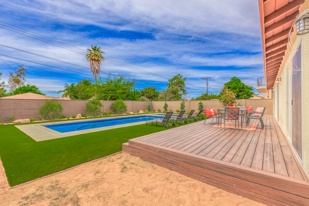 Large transitional backyard concrete and rectangular lap hot tub photo in Orange County