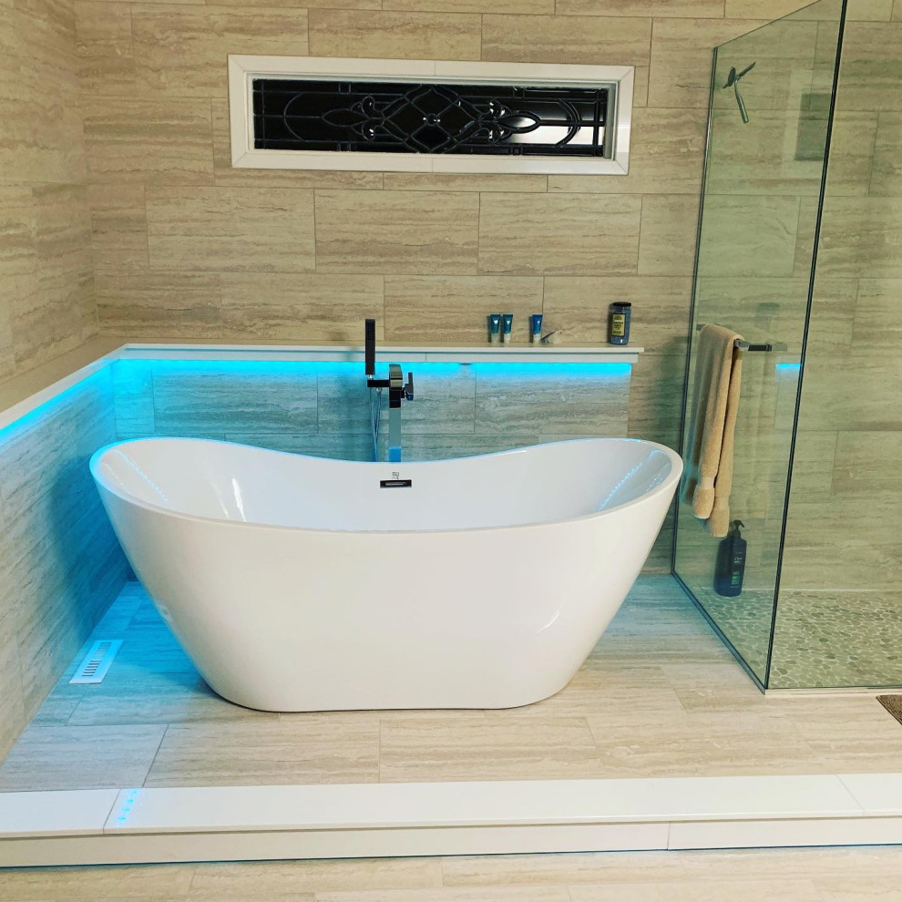 Inspiration for a large modern master wet room bathroom in Charlotte with a freestanding tub, beige tile, beige walls, wood-look tile, beige floor, a hinged shower door and vaulted.