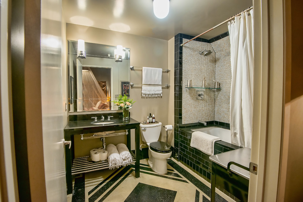 Photo of a mid-sized transitional bathroom in Los Angeles with open cabinets, an alcove tub, a shower/bathtub combo, a two-piece toilet, black and white tile, mosaic tile, beige walls, a console sink and a shower curtain.