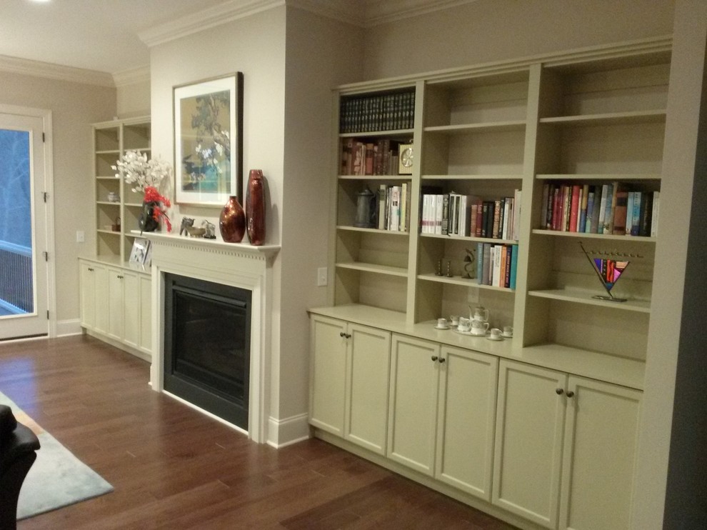 This is an example of a large transitional open concept family room in Raleigh with medium hardwood floors.