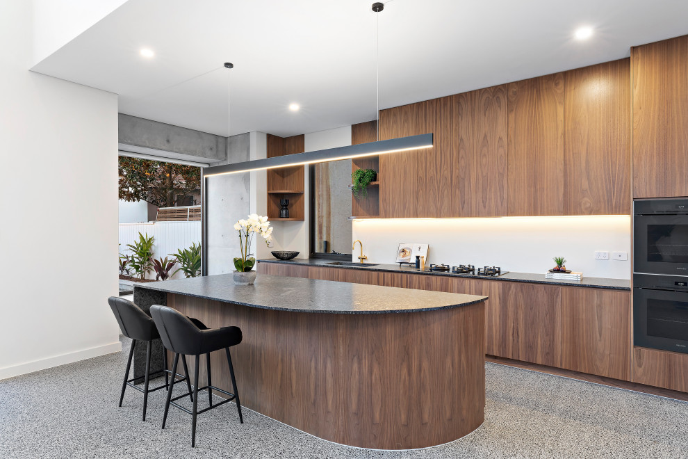 This is an example of a modern kitchen in Sydney with with island.