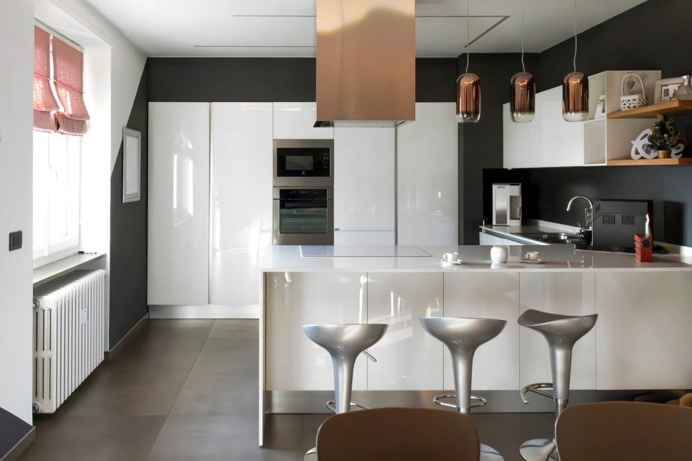 Photo of a large modern u-shaped kitchen/diner in Turin with a built-in sink, glass-front cabinets, white cabinets, glass worktops, grey splashback, porcelain flooring, a breakfast bar, grey floors, white worktops and a drop ceiling.