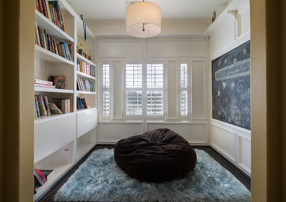 Design ideas for a small traditional gender-neutral kids' study room in Houston with dark hardwood floors.