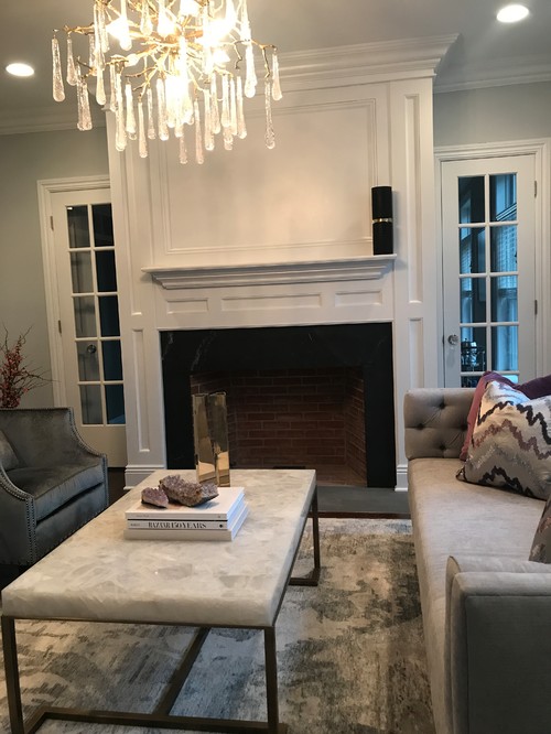 Should I paint my red brick fireplace? A designer I used to work with said my fireplace was an eye sore and suggested I paint it black or white. Is this something that you would do? And is it safe to just paint it given flammability of paint?