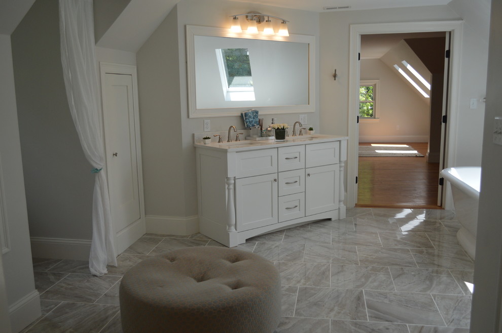 Inspiration for a mid-sized transitional master beige tile and cement tile bathroom remodel in Boston with raised-panel cabinets, dark wood cabinets, a hot tub, an undermount sink, quartz countertops and beige countertops