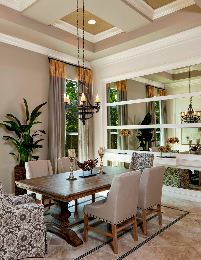 Transitional dining room in Miami with beige walls.