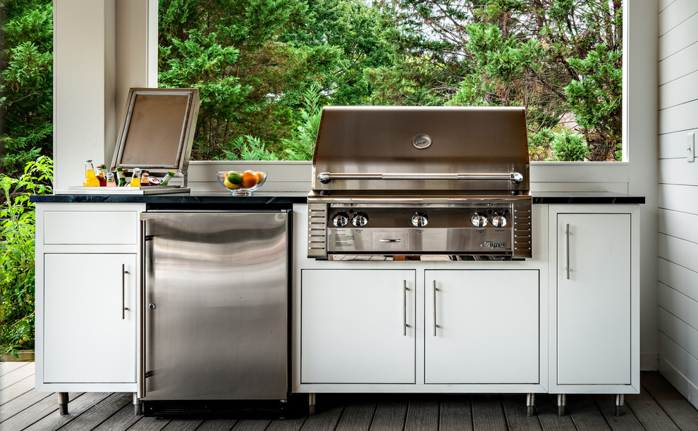Example of a trendy backyard patio kitchen design in Nashville with decking and a roof extension