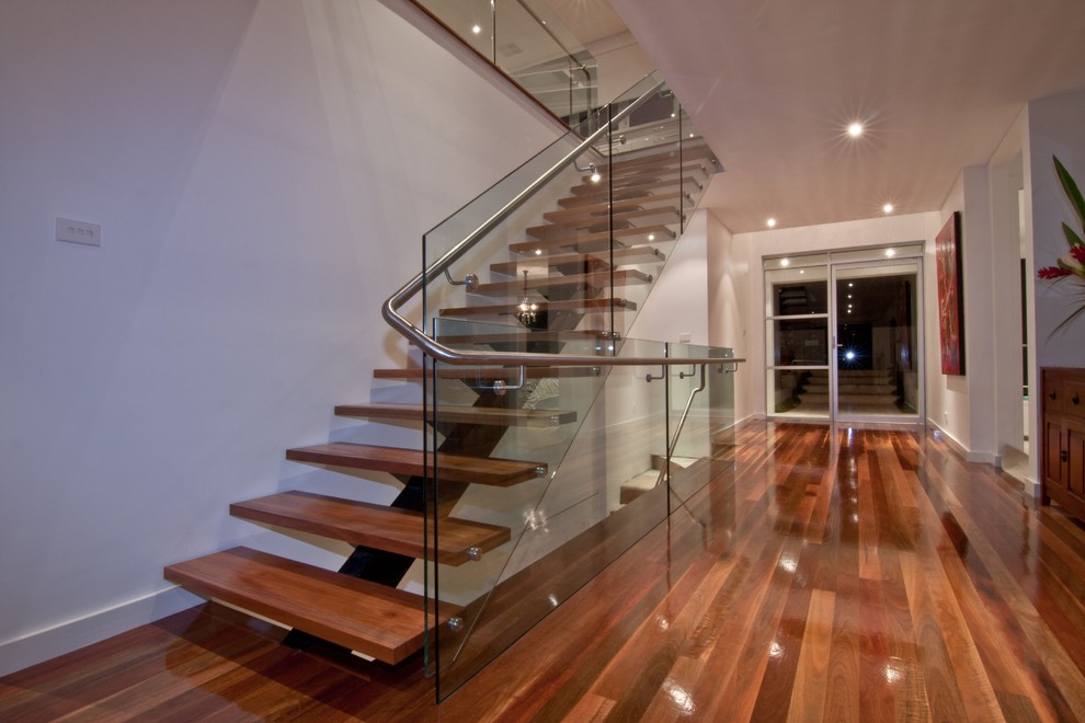 Contemporary straight staircase in Sydney with white walls.
