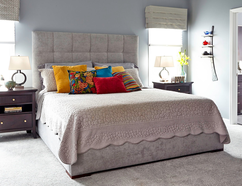 Inspiration for a large transitional master bedroom in Other with grey walls and carpet.