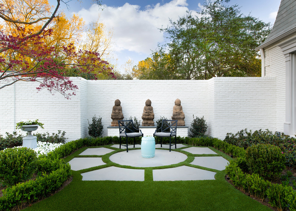 Photo of a traditional formal garden in Dallas with concrete pavers.