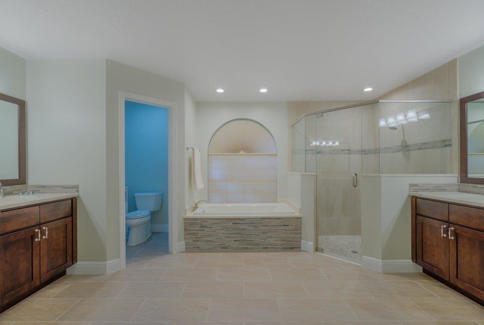 Home design - transitional beige tile and porcelain tile porcelain tile home design idea in Miami with shaker cabinets, medium tone wood cabinets, a two-piece toilet, an undermount sink and quartz countertops