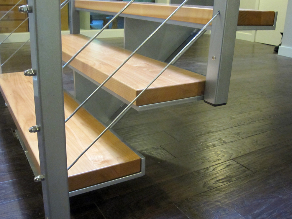 Inspiration for a mid-sized contemporary wood floating staircase in Vancouver with open risers.