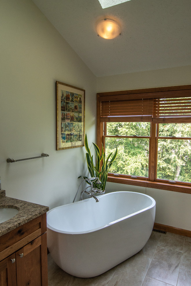 Photo of a country bathroom in Other with a freestanding tub, a curbless shower and a hinged shower door.