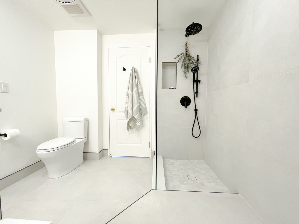 Design ideas for a mid-sized modern master bathroom in Toronto with flat-panel cabinets, a freestanding vanity, beige cabinets, an alcove tub, an open shower, a two-piece toilet, gray tile, porcelain tile, white walls, porcelain floors, engineered quartz benchtops, grey floor, an open shower, white benchtops, a niche and a single vanity.
