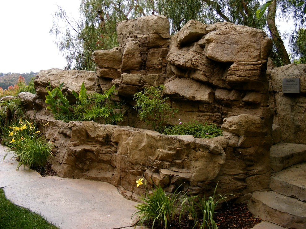 This is an example of a rustic backyard landscaping in Orange County.