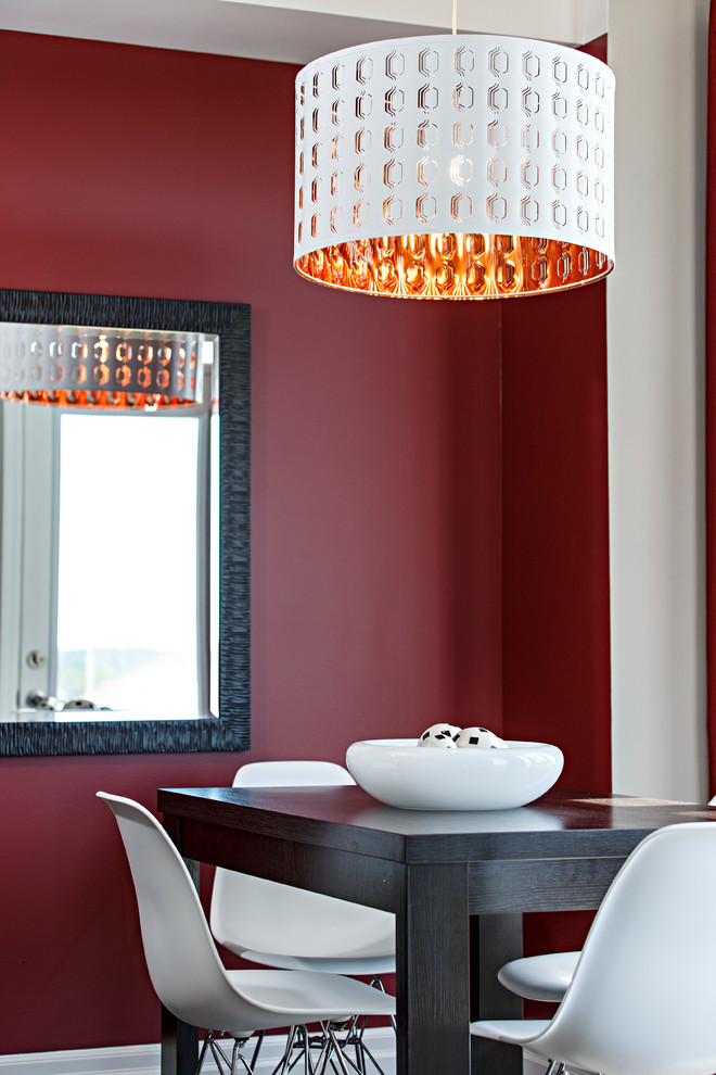 This is an example of a contemporary kitchen/dining combo in Ottawa with red walls.