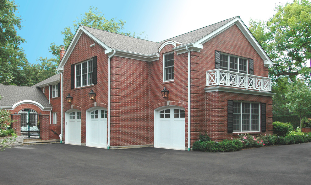 Design ideas for a large traditional two-storey brick red exterior in Chicago with a gable roof.