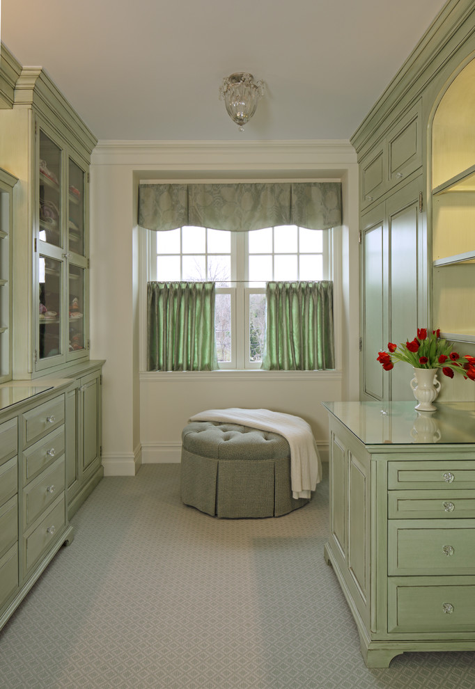 Design ideas for a large traditional women's dressing room in Bridgeport with raised-panel cabinets, green cabinets, carpet and multi-coloured floor.