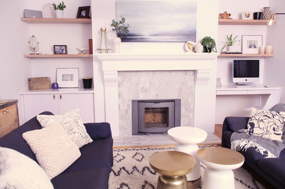 Inspiration for a scandinavian enclosed living room in Montreal with a standard fireplace and a tile fireplace surround.
