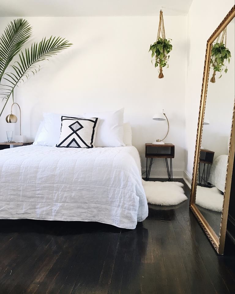 Bedroom - mid-sized scandinavian master dark wood floor and black floor bedroom idea in Philadelphia with white walls