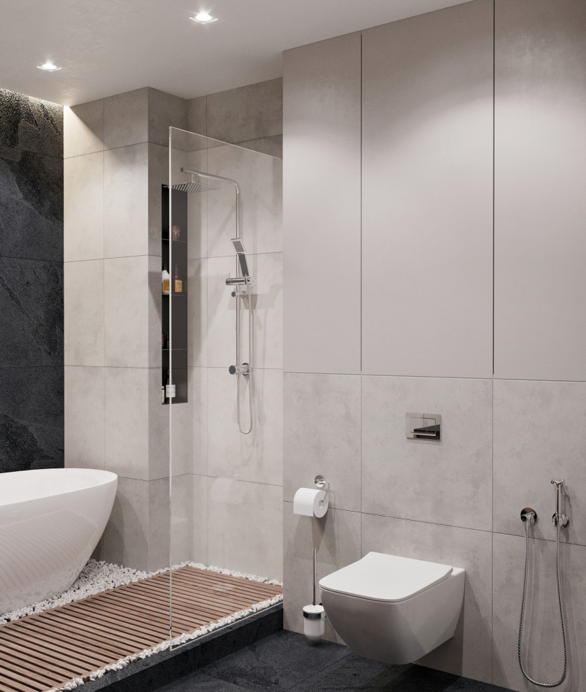 Inspiration for a mid-sized contemporary master bathroom in Other with flat-panel cabinets, a freestanding tub, a shower/bathtub combo, a wall-mount toilet, gray tile, porcelain tile, grey walls, a vessel sink, black floor, a shower curtain, black benchtops, medium wood cabinets, porcelain floors and solid surface benchtops.