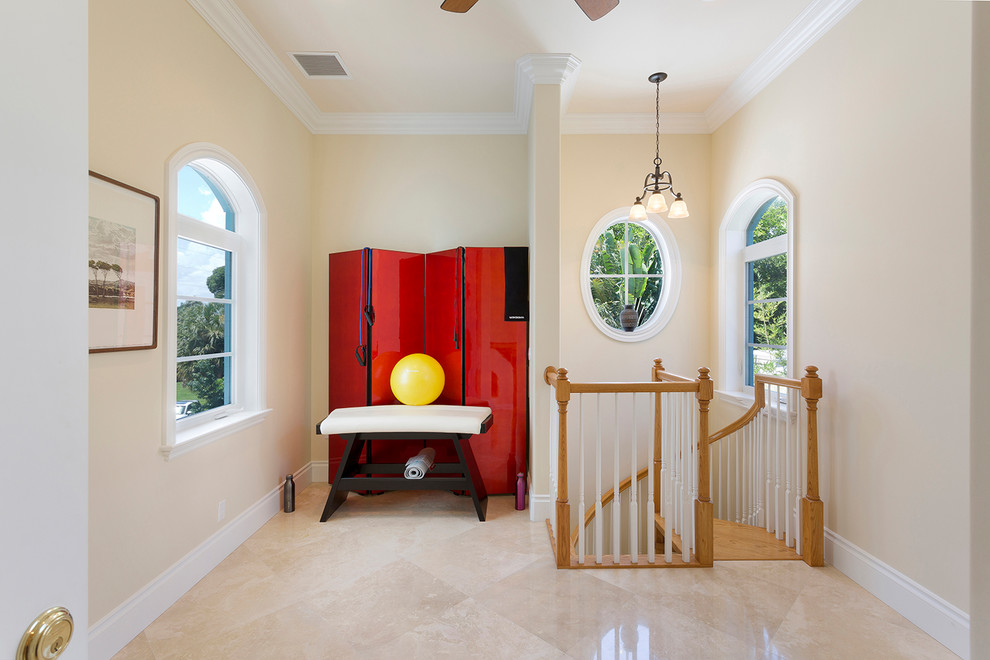 Photo of a mid-sized transitional home yoga studio in Miami with beige walls, marble floors and beige floor.
