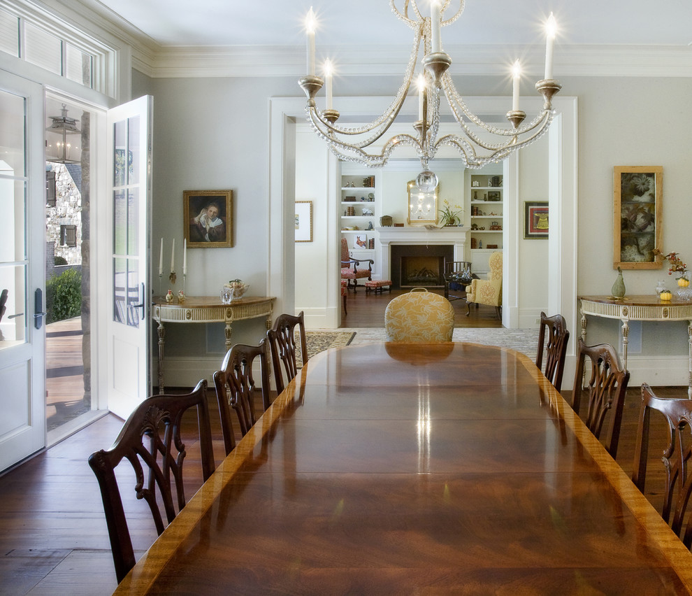 Photo of a large traditional dining room in Nashville with grey walls, dark hardwood floors and brown floor.